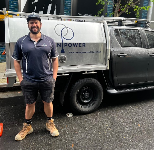 Tradie Paul Messina, standing infront of work van.